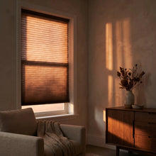 Load image into Gallery viewer, Interior view of a inviting living room styled with Warm Brown (5_Warm Cocoa) 9 16 Classic Single Cell Light Filtering Cordless Shades, providing excellent UV protection and a soft ambient light.
