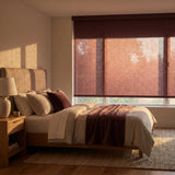 Contemporary Fabric Light Filtering Roller Shades offer warm brown ambiance, perfect for modern bedrooms like this one, where natural light and comfort come together.