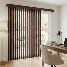 Load image into Gallery viewer, Wood Grain Faux Wood PVC Vertical Blinds in warm brown harmonize with the rustic wooden desk and bookshelves, perfectly filtering natural light for a productive workspace
