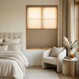 Sunlight hits the Warm Brown (Plymouth) 5 8 Daynight Single Cell Cellular Cordless Shades in this modern bedroom, providing a stylish and practical window treatment solution.