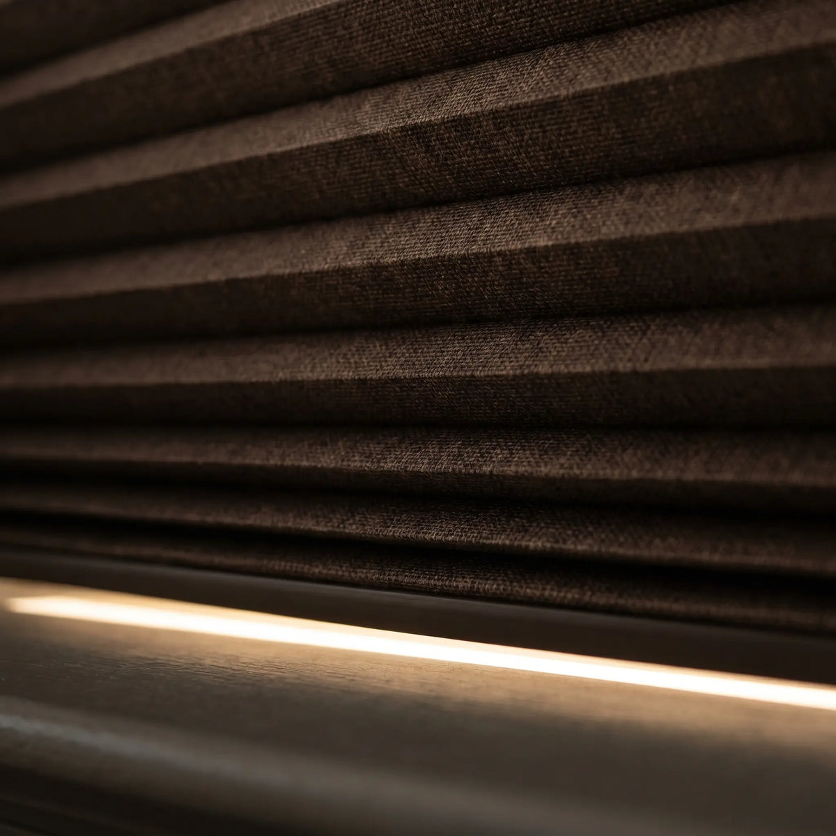Styling a warm retreat with Warm Brown 1 2 Inch Budget Single Cell Blackout Cordless Shades, shielding the interior from bright daylight and street lamps.