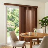 Wood Grain Faux Wood PVC Vertical Blinds in Warm Brown perfectly complement white walls and wooden furniture, creating a warm inviting ambiance in this dining area.