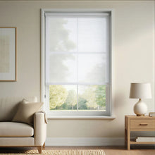Load image into Gallery viewer, Bright and minimalist White Signature solar roller shades with 3% openness, offering a clean look that maximizes daytime privacy and energy efficiency in a sun-lit living space.
