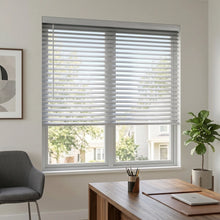 Load image into Gallery viewer, View of a cozy living room with White (Brushed Aluminum) Classic Cordless 8g Aluminum Mini Blinds, filtering incoming daylight efficiently across the space.
