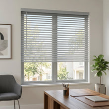 Load image into Gallery viewer, Wide view of White (Dove Grey) Classic Cordless 8g Aluminum Mini Blinds complementing a cozy study, offering lightweight yet sturdy window coverage.
