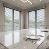 Hardwood Cordless Horizontal Blinds in White effortlessly filter natural light, harmonizing with the room's soft ambiance and minimalist furniture arrangement.