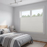 White Llama Signature Blackout Double Cellular Shade on a bedroom window beside a wood nightstand