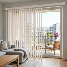 Load image into Gallery viewer, Interior view of a space with a cozy atmosphere styled with White (Mammoth Powder) 3 1/2 Inch S Shape Pvc Vertical Blinds, combining practical light filtering with a soft, rippled design.
