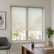 Load image into Gallery viewer, Natural sunlight hits the White (Navajo) Classic Cordless 8g Aluminum Mini Blinds in a cozy bedroom, filtering incoming daylight efficiently across the space.

