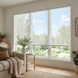 Premier 10% Solar Screen Roller Shade adds a touch of creamy white elegance to this inviting living space, while filtering UV rays and maintaining privacy.