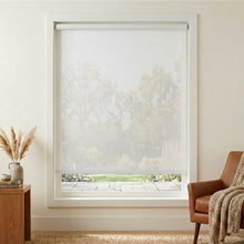 Load image into Gallery viewer, Enhance your Premier 5% Solar Screen Roller Shade's creamy white design, blocking UV rays while allowing natural light to flow into this inviting cozy living room
