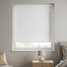 Load image into Gallery viewer, Classic White Signature blackout shades installed in a nursery to create a perfectly dark sleeping environment.
