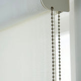 Extreme detail macro closeup of the white sheer light filtering fabric weave, showcasing the delicate transparency.