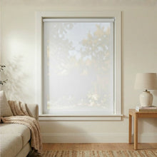 Load image into Gallery viewer, Main front view of a White (1 Percent Openness) Signature solar roller shade in a sun-drenched living room.
