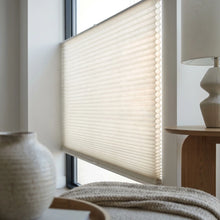 Load image into Gallery viewer, White 9 16 Classic Single Cell Light Filtering Cordless Top Downbottom Up Cordless Shades installed in a cozy living room, protecting against UV rays while offering top-down versatility.
