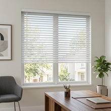 Load image into Gallery viewer, White (Snow Cap) Classic Cordless 8g Aluminum Mini Blinds providing a structured touch to a cozy living room, ensuring a clean, cordless aesthetic and enhanced child safety.
