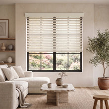 Load image into Gallery viewer, Natural light pours in through partially open Hardwood Cordless Horizontal Blinds, adding warmth and serenity to this peaceful living room.
