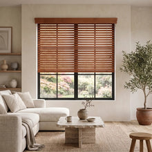 Load image into Gallery viewer, A hardwood cordless horizontal blind in rich Wooden tones harmonizes with the serene room, where plush velvet sofas and matching ottomans create a comfortable retreat.
